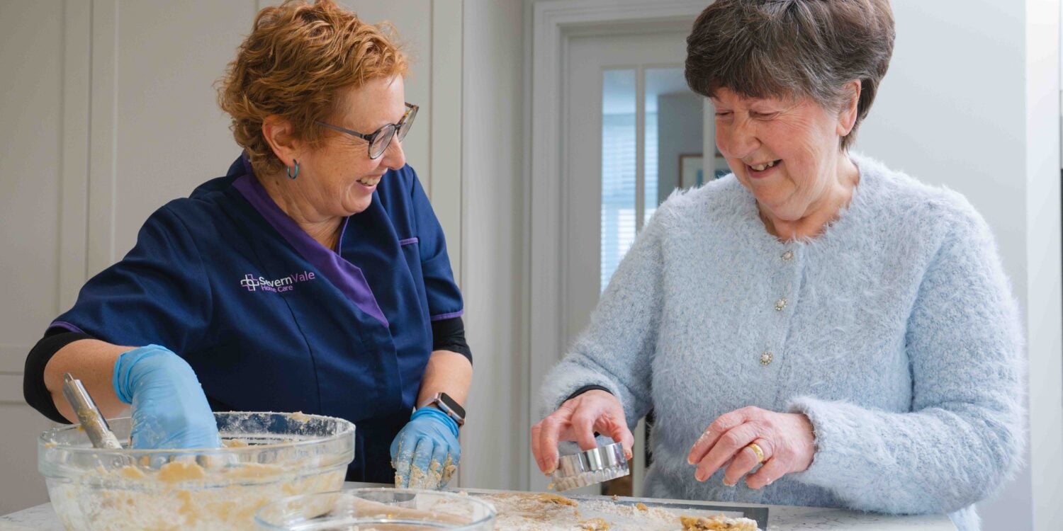 Severn Vale Home Care Carer baking with patient