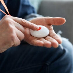 elderly person using their personal alarm
